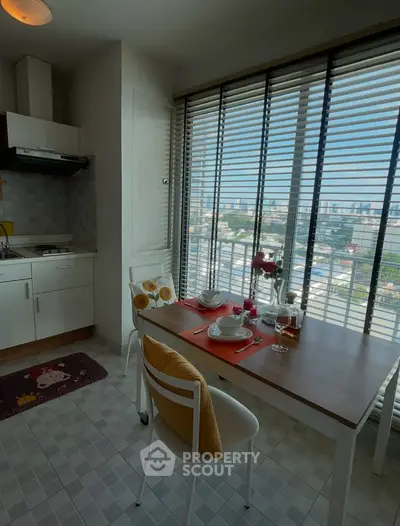 Charming kitchen with city view, cozy dining setup, and modern design