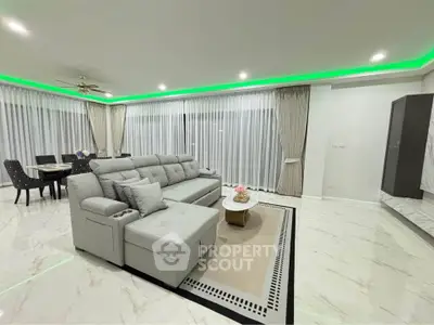 Luxurious modern living room with elegant decor and ambient lighting