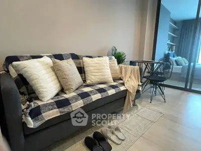 Cozy living room with stylish sofa and modern decor, perfect for relaxation.