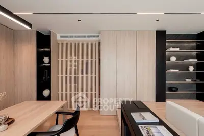 Modern living room with sleek wooden accents and minimalist decor