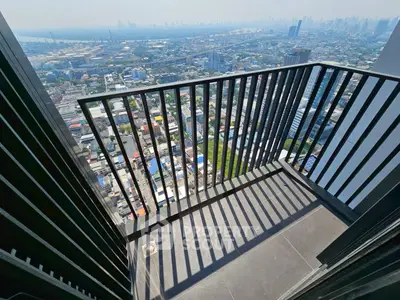 Stunning high-rise balcony with panoramic city view, perfect for urban living enthusiasts.