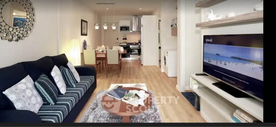 Stylish open-plan living room with modern kitchen and cozy decor