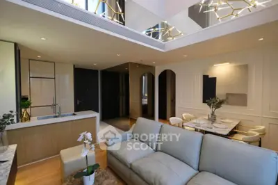 Luxurious modern living room with open kitchen and elegant decor