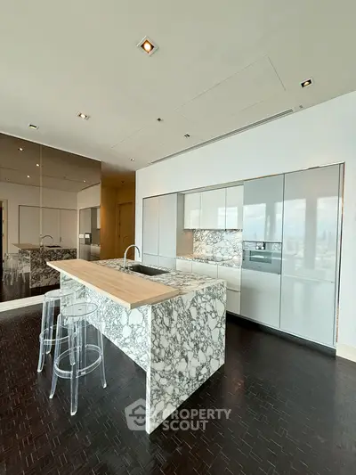 Luxurious modern kitchen with marble island and sleek cabinetry