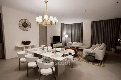 Luxurious modern living room with elegant chandelier and stylish furniture