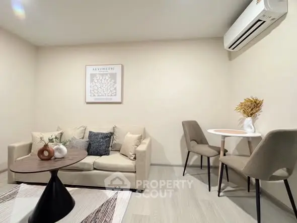 Modern living room with cozy beige sofa and stylish decor