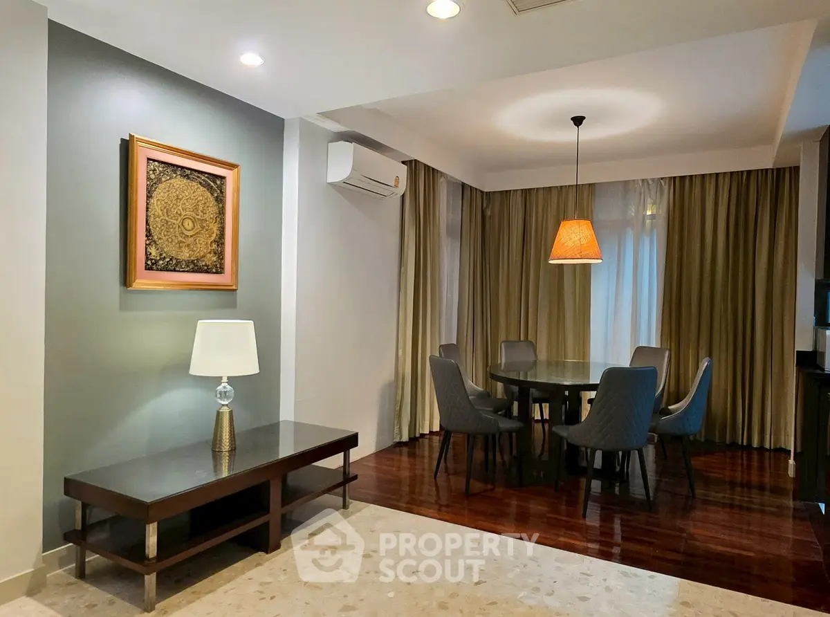 Elegant dining area with modern decor and ambient lighting in a stylish apartment.