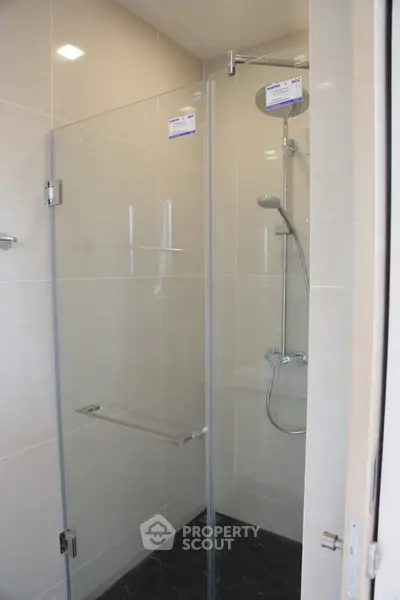 Modern bathroom shower with glass enclosure and sleek fixtures