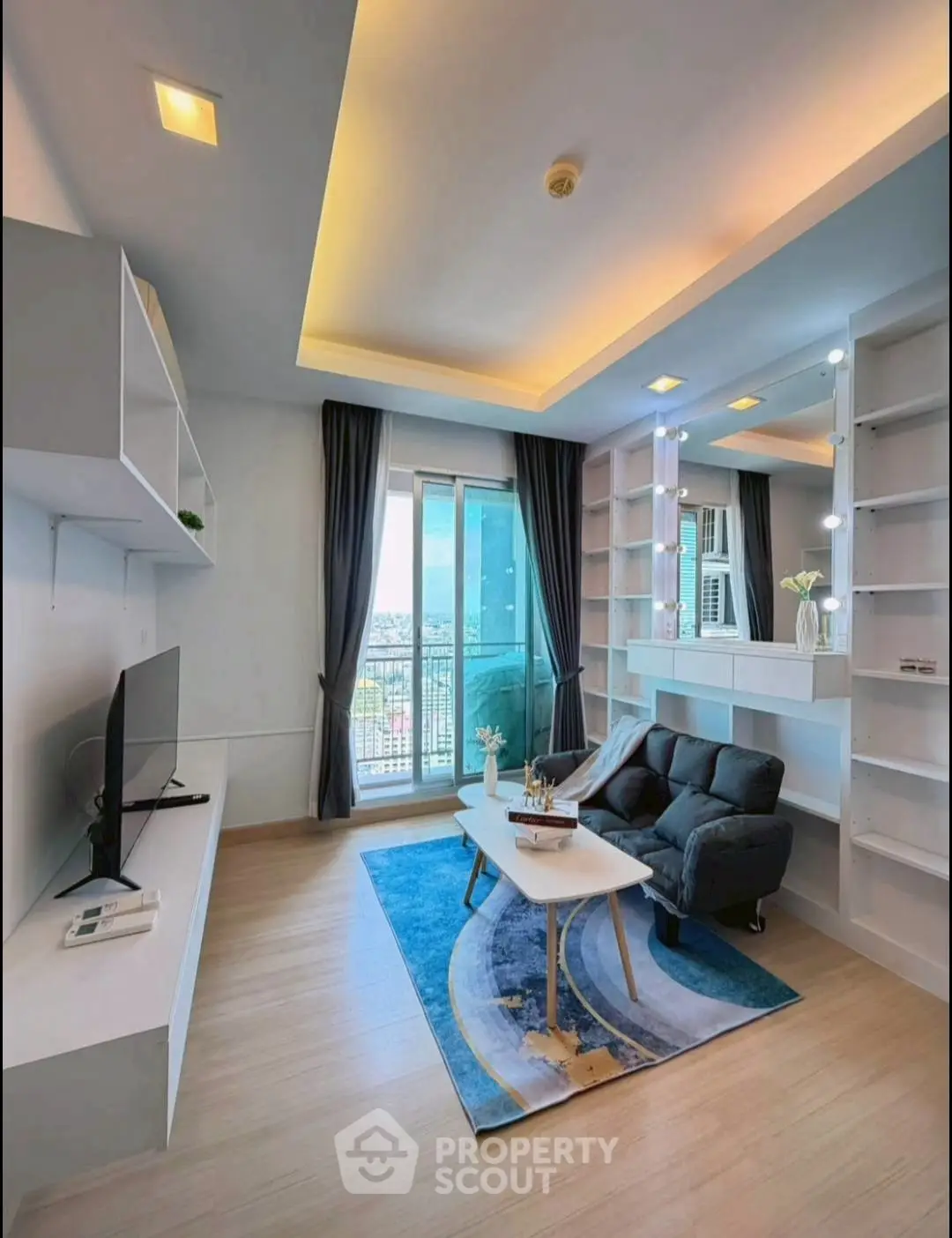 Modern living room with stylish decor and balcony view