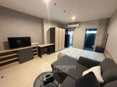 Modern studio apartment with sleek furniture and cozy ambiance