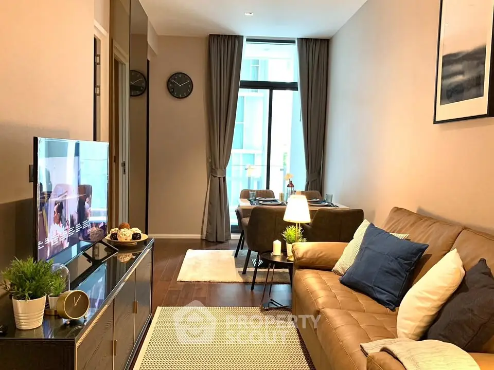 Modern living room with cozy seating and stylish decor in a contemporary apartment.