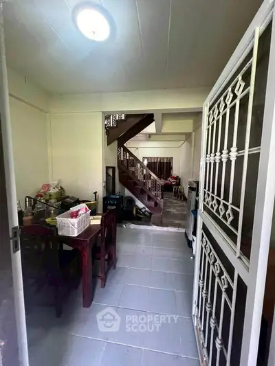 Cozy interior with dining area and staircase in a charming home