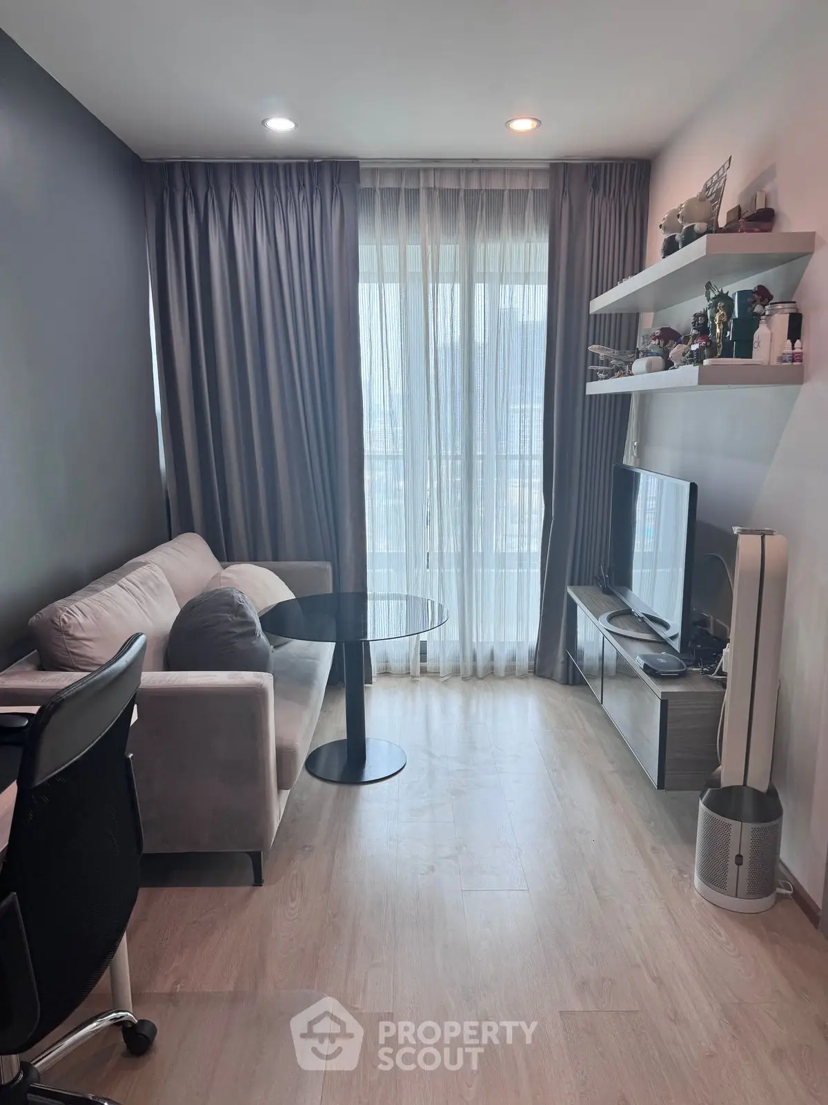 Modern living room with sleek furniture and natural light, perfect for urban living.