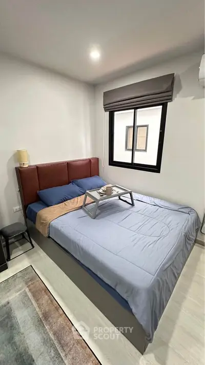 Cozy bedroom with modern decor and natural light