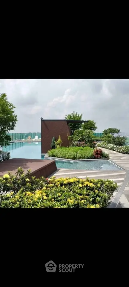 Luxurious rooftop garden with pool offering stunning city views and lush greenery.