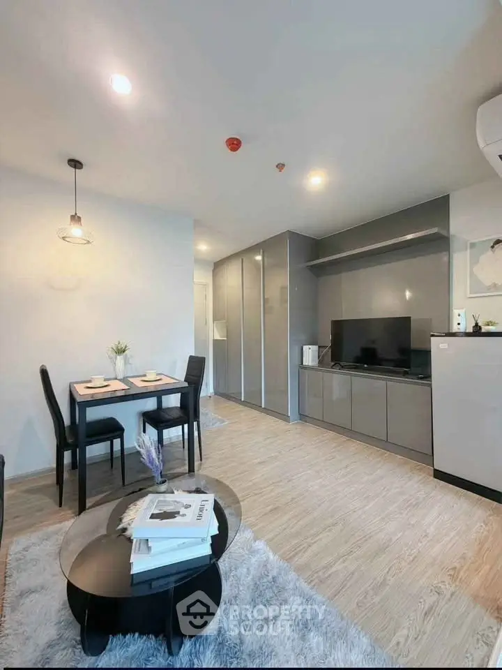 Modern living room with sleek furniture and stylish decor in a contemporary apartment.