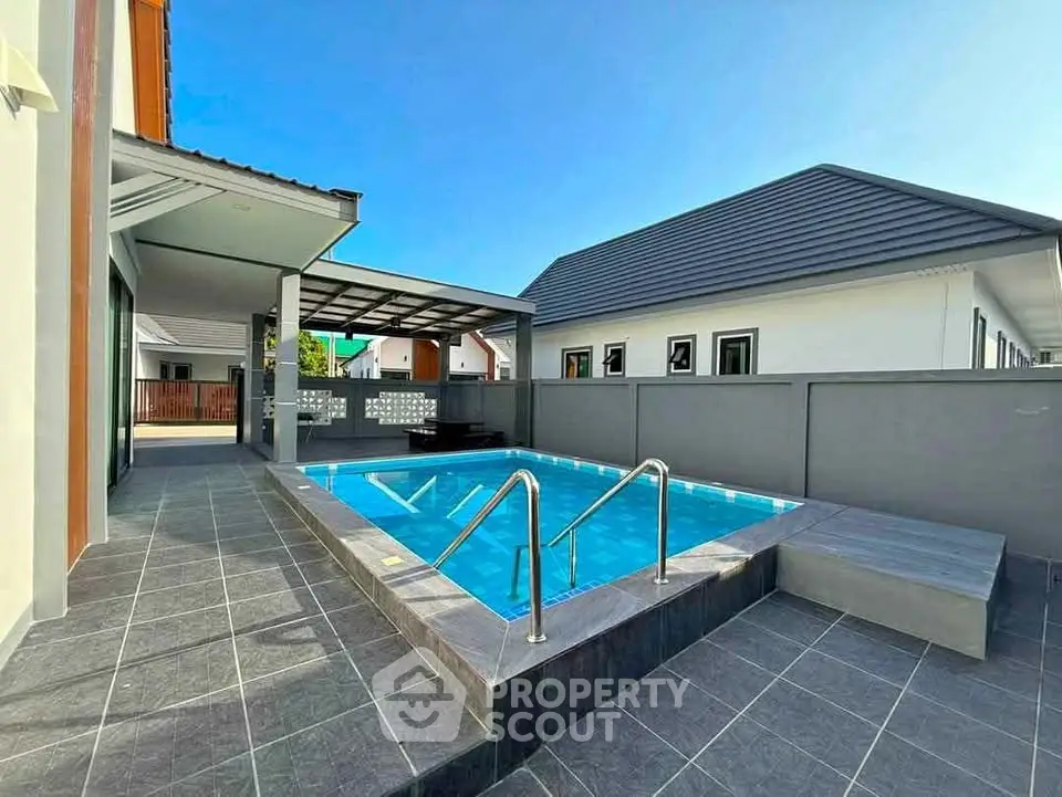 Modern home with private pool and sleek patio design