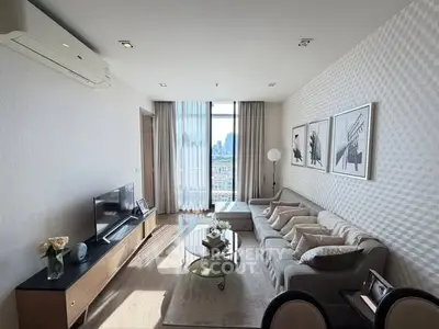 Modern living room with city view, stylish decor, and natural light