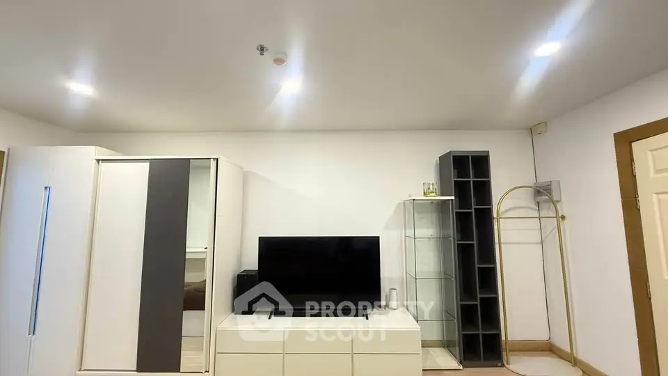 Modern living room with sleek furniture and ample storage space