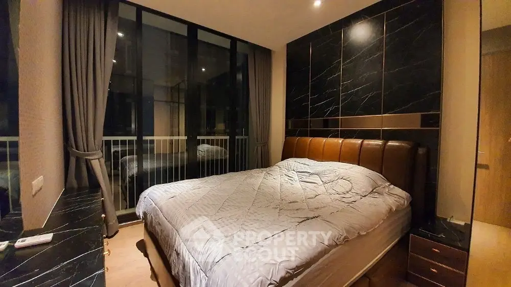 Luxurious bedroom with modern design and floor-to-ceiling windows
