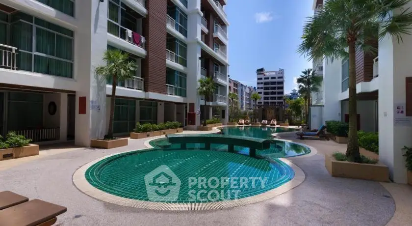 Luxurious apartment complex with stunning pool and lush greenery, perfect for modern living.