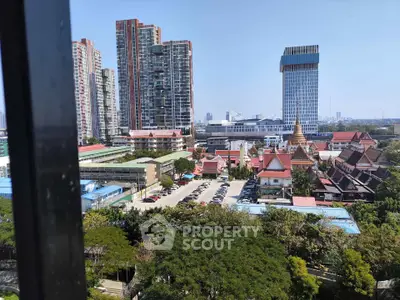 Stunning cityscape view with modern high-rise buildings and lush greenery, perfect for urban living.