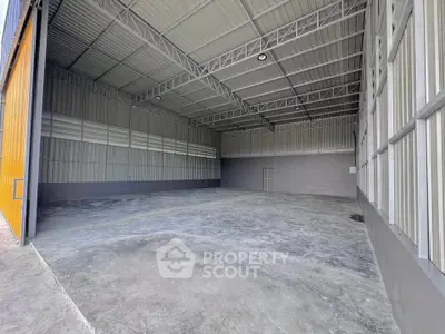 Spacious industrial warehouse with high ceilings and open layout
