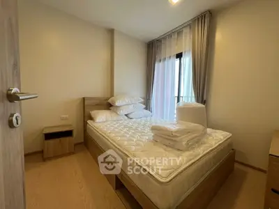 Cozy bedroom with natural light and modern furnishings