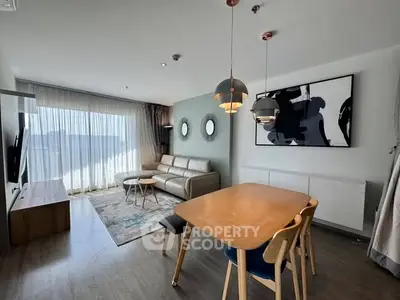 Modern living room with stylish decor and ample natural light