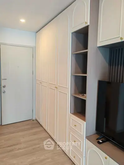 Modern living room with built-in storage and sleek TV setup