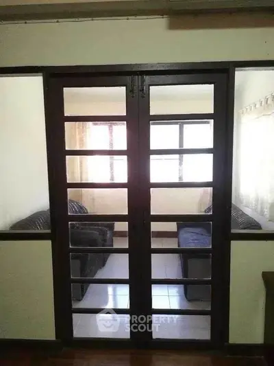 Cozy living room with glass doors and comfortable seating