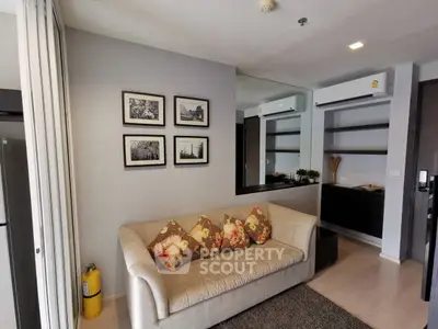 Modern living room with cozy sofa and stylish decor in a contemporary apartment.