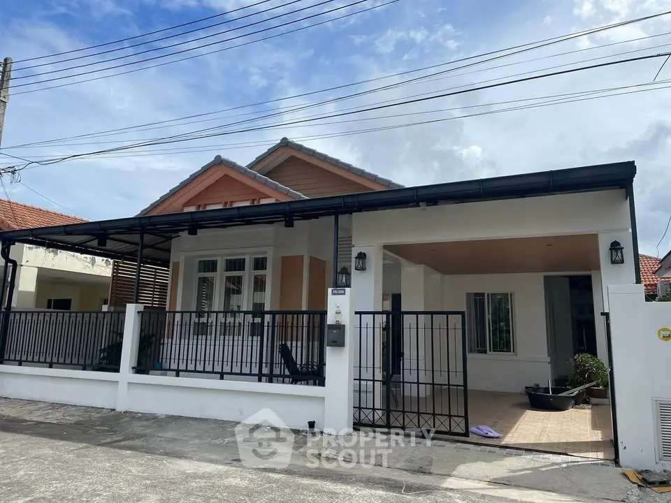 Charming single-story house with a spacious front patio and modern design.