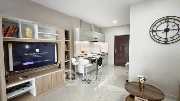 Modern open-plan living room with sleek kitchen and stylish decor