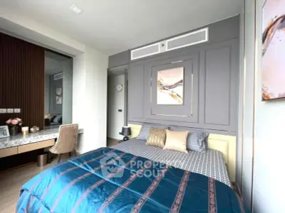 Luxurious bedroom with elegant decor and modern furnishings, featuring a stylish bed and a chic vanity area.