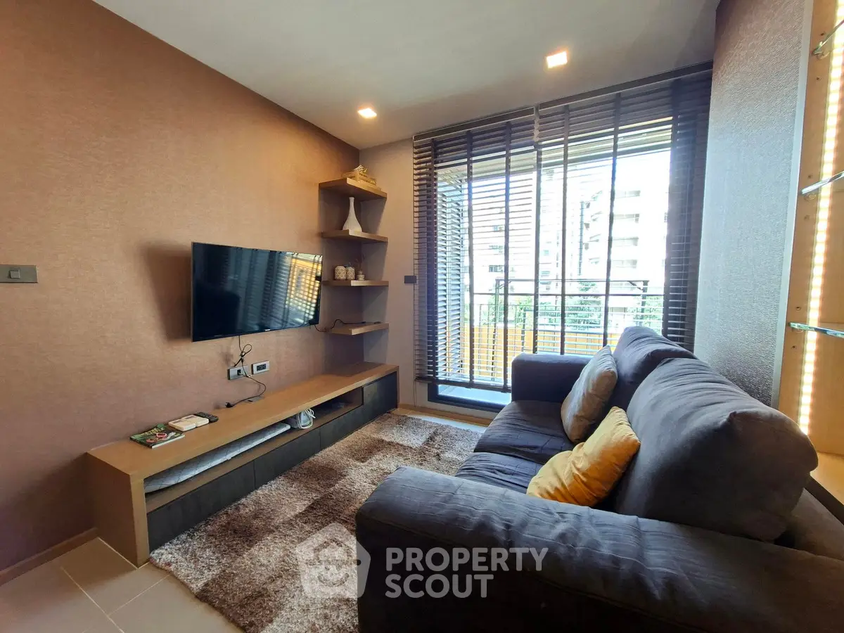 Modern living room with cozy sofa and large window view