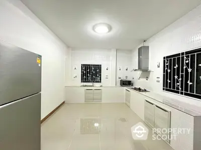 Spacious modern kitchen with sleek appliances and ample counter space