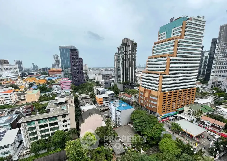 Stunning cityscape view showcasing modern high-rise buildings and lush greenery in a vibrant urban setting.