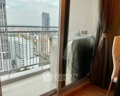 Modern high-rise balcony with city view and washing machine setup.
