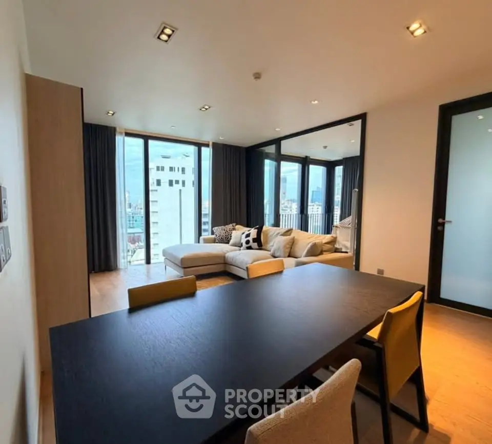 Spacious modern living room with city view and stylish furniture