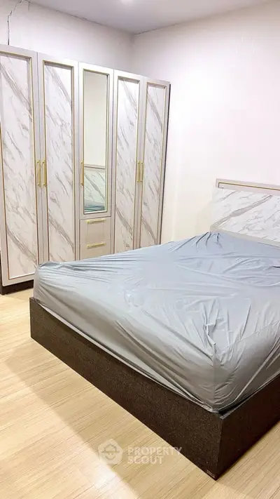 Modern bedroom with stylish wardrobe and sleek bed design