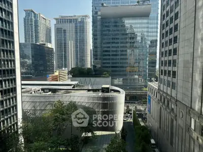 Stunning urban view showcasing modern skyscrapers and lush greenery in a vibrant cityscape.