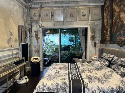 Luxurious bedroom with elegant decor and balcony view