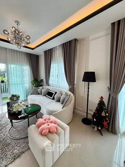 Elegant living room with modern decor and large windows for natural light.