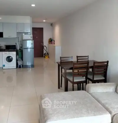 Spacious open-plan living room with modern kitchen and dining area