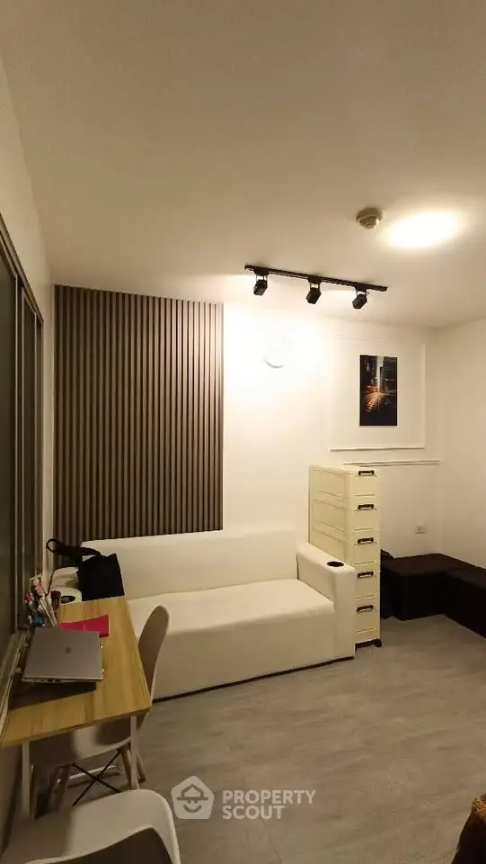 Modern living room with sleek design and cozy seating area