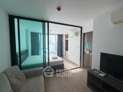 Modern studio apartment with glass partition and natural light