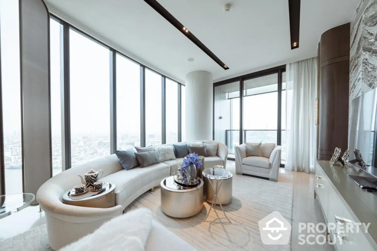 Luxurious modern living room with panoramic city views and elegant furnishings.