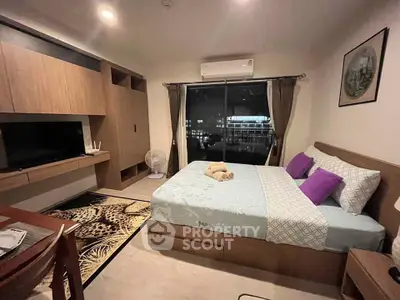 Modern bedroom with stylish decor and large window view