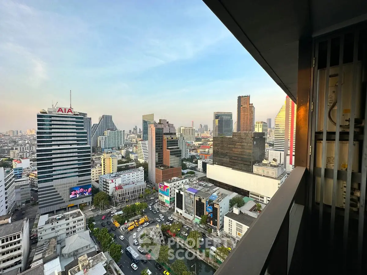Stunning cityscape view from a high-rise balcony overlooking vibrant urban skyline.